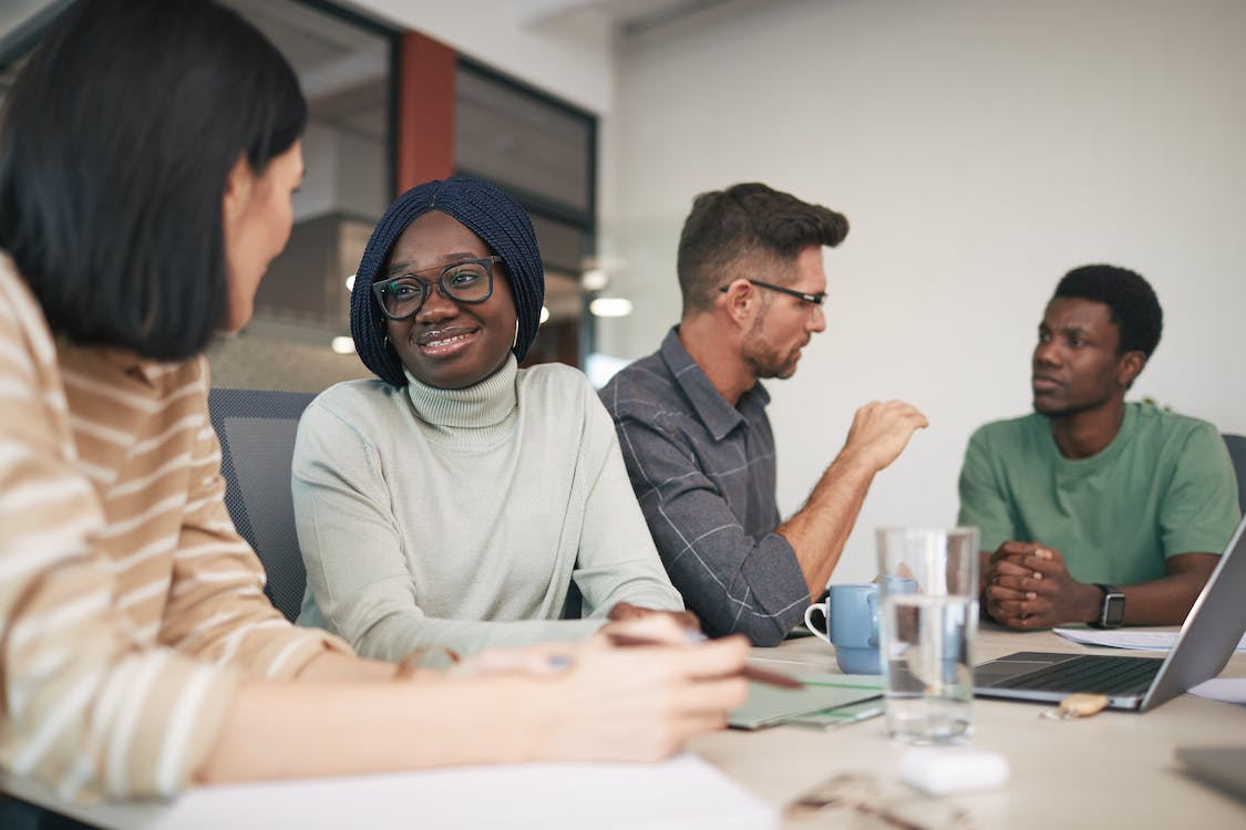 Free A Group of People Having a Meeting in the Office Stock Photo