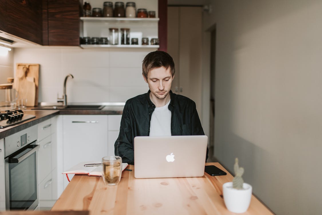 Free Photo Of Man Using Laptop Stock Photo