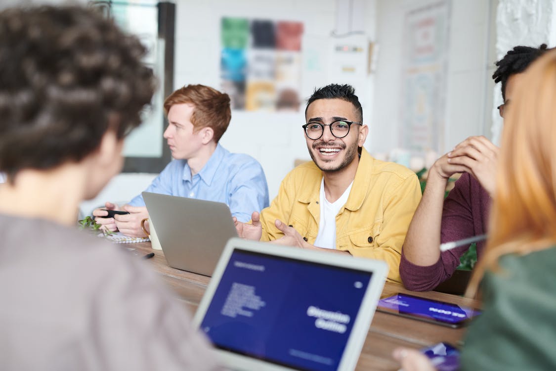 Free Man Wearing Yellow Dress Shirt Using Silver Laptop Stock Photo
