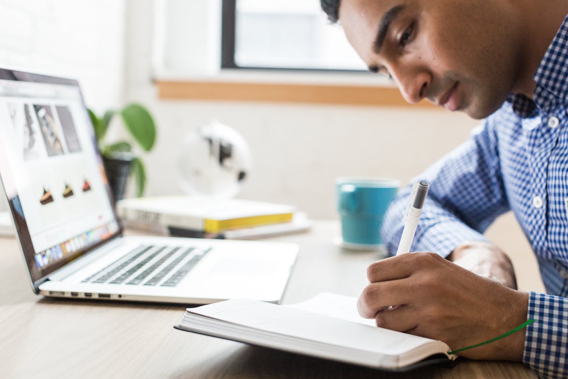 Free Man Using Ballpoint Pen Stock Photo