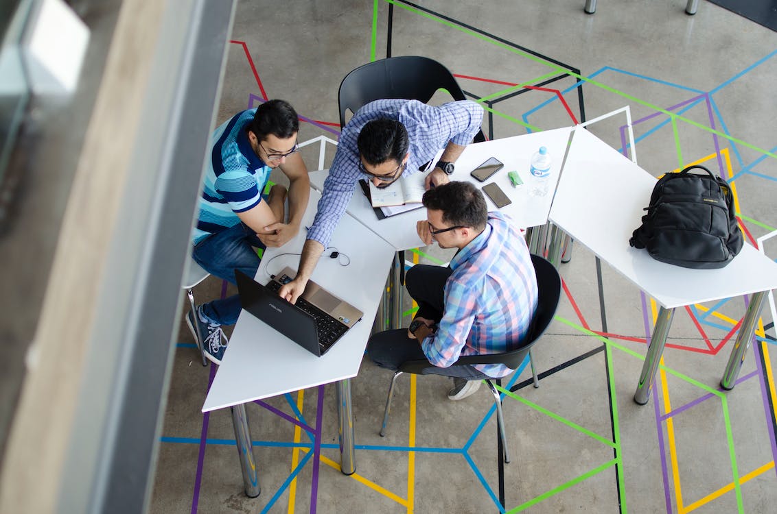 Free Top-view Photo of 3 Men in Front of Laptop Stock Photo