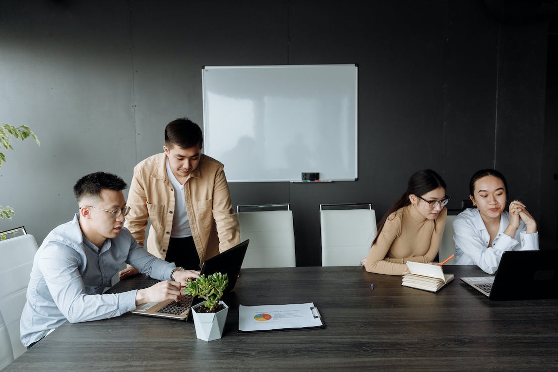 Free Men and Women Working at the Office Stock Photo