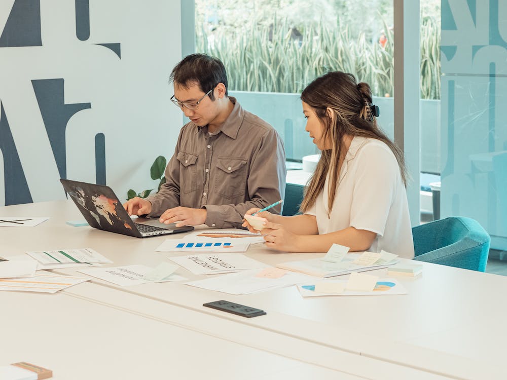 Free Man and Woman Working at the Office Stock Photo