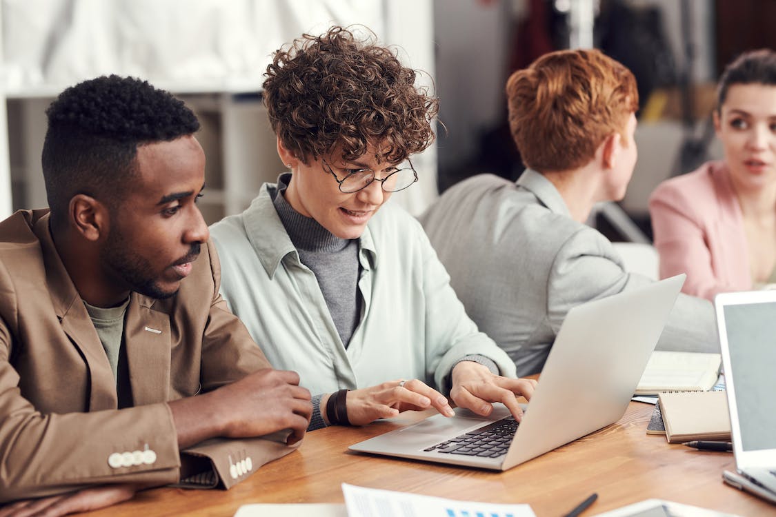 Free Photo Of People Looking On Laptop Stock Photo